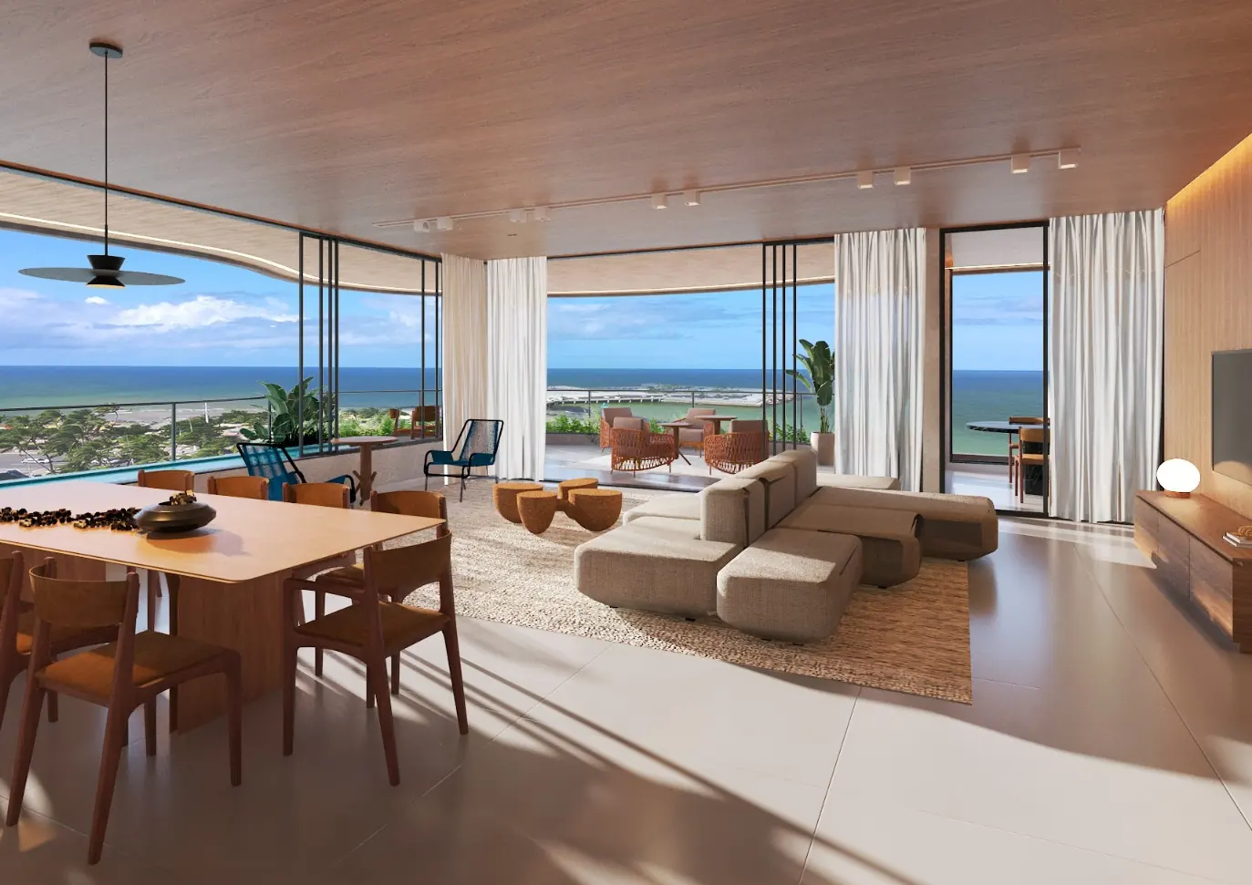 Sala de estar e jantar do América Veiga com vista para o mar